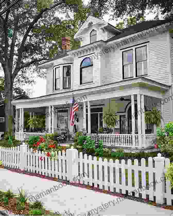 A Large, Two Story House With A White Picket Fence. The House Has A Large Front Porch With A Staircase Leading Up To It. Ghostland: An American History In Haunted Places