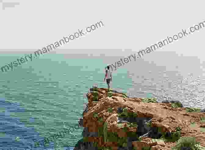 A Man Standing Confidently On A Cliff, Looking Out At The Horizon. The Change In Your Relationship Starts With You: What If You Showed Up As The Man You Were Meant To Be?