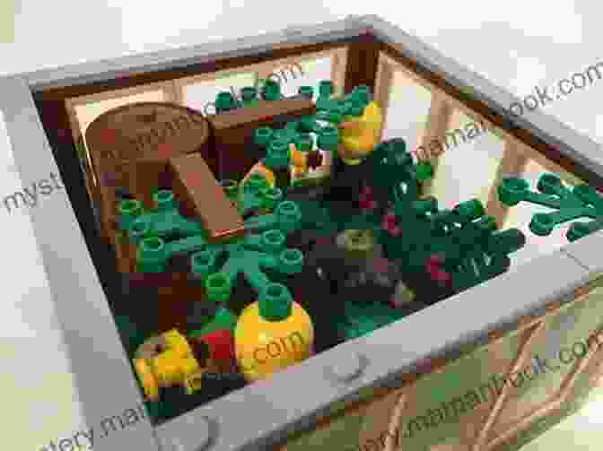 A Young Child Sitting At A Table, Building LEGO Zoo Animals While Smiling And Looking Focused. The LEGO Zoo: 50 Easy To Build Animals