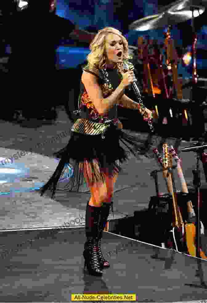 Carrie Underwood Performing On Stage With A Microphone In Her Hand, Her Eyes Closed And Her Head Tilted Back Carrie Underwood Biography Of A Country Soul Singer