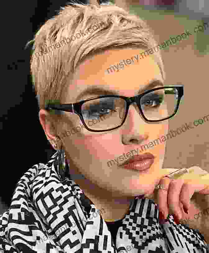 Mabel Katz, A Woman With Short Gray Hair And Glasses, Smiles Confidently While Looking At The Camera Surviving Sexploitation Mabel Katz